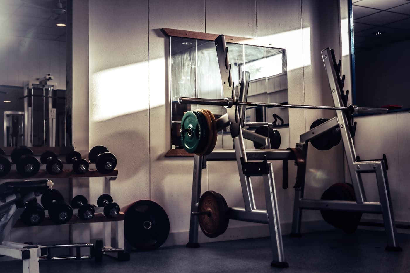 Weight plates stacked near gym equipment